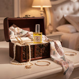 A square glass bottle of Classic OASIS Parfum with a silver cap, filled with a bright yellow liquid, set against a clean white background with a soft reflection below.